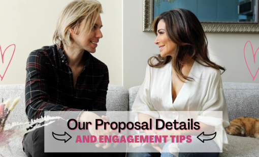 Engaged couple sitting on couch together and smiling.