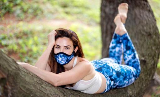 Blogger Bianca Jade wears a tie dye face mask.