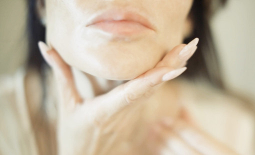 Bianca Jade's face. Woman touching her chin with fingers.